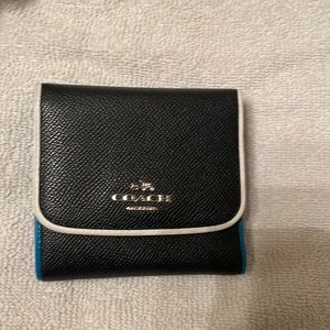 Coach small trifold wallet …..has a matching purse sold separately